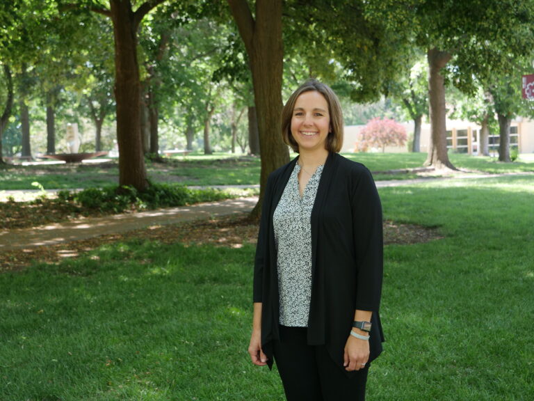 Photo of Becky Bartell standing on the Green