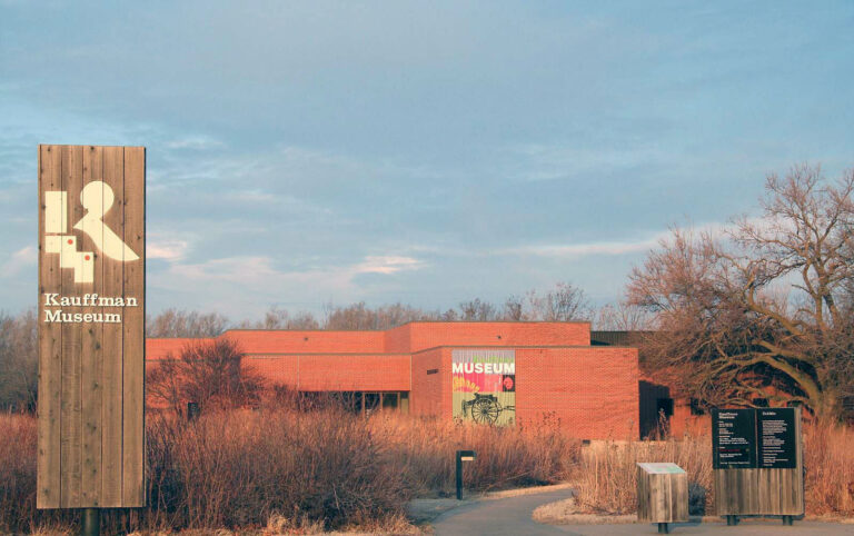 Exterior of Kauffman Museum on a sunny afternoon