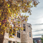 Front view of Ad Building, taken from the side, with fall foliage