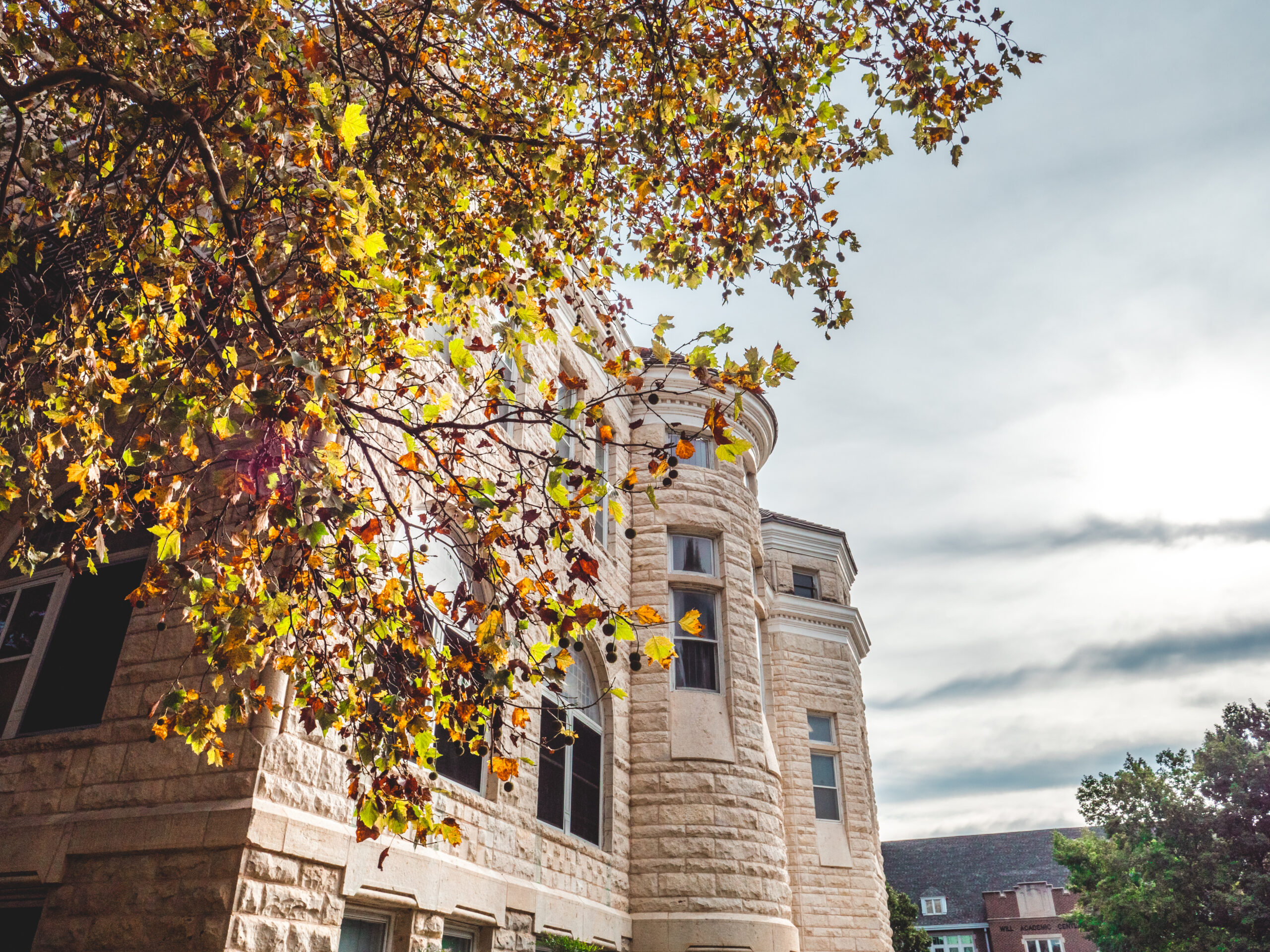 Front view of Ad Building, taken from the side, with fall foliage